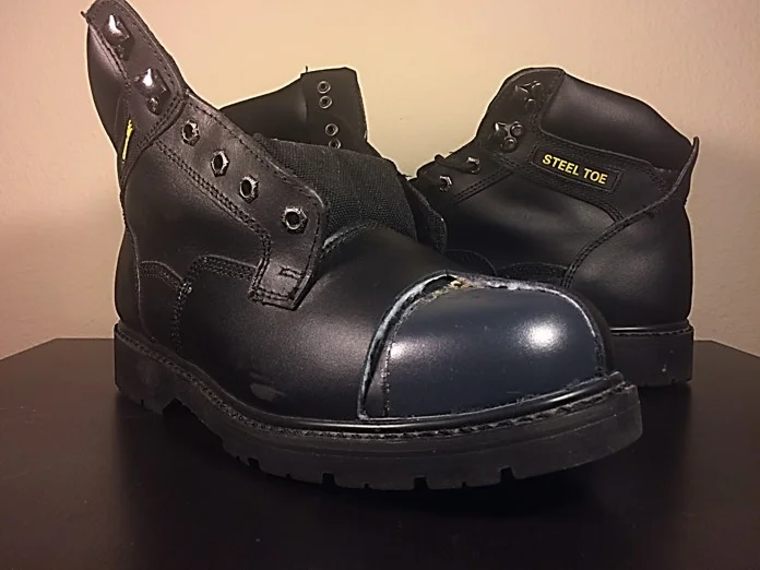 A cut away of this steel toe boot shows the interior steel shell designed to protect the toes of the worker.