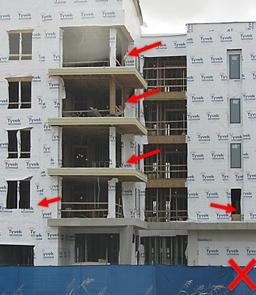 Although guardrails have been installed in some areas at this job site, notice the broken sections both on the open edges and at windows.