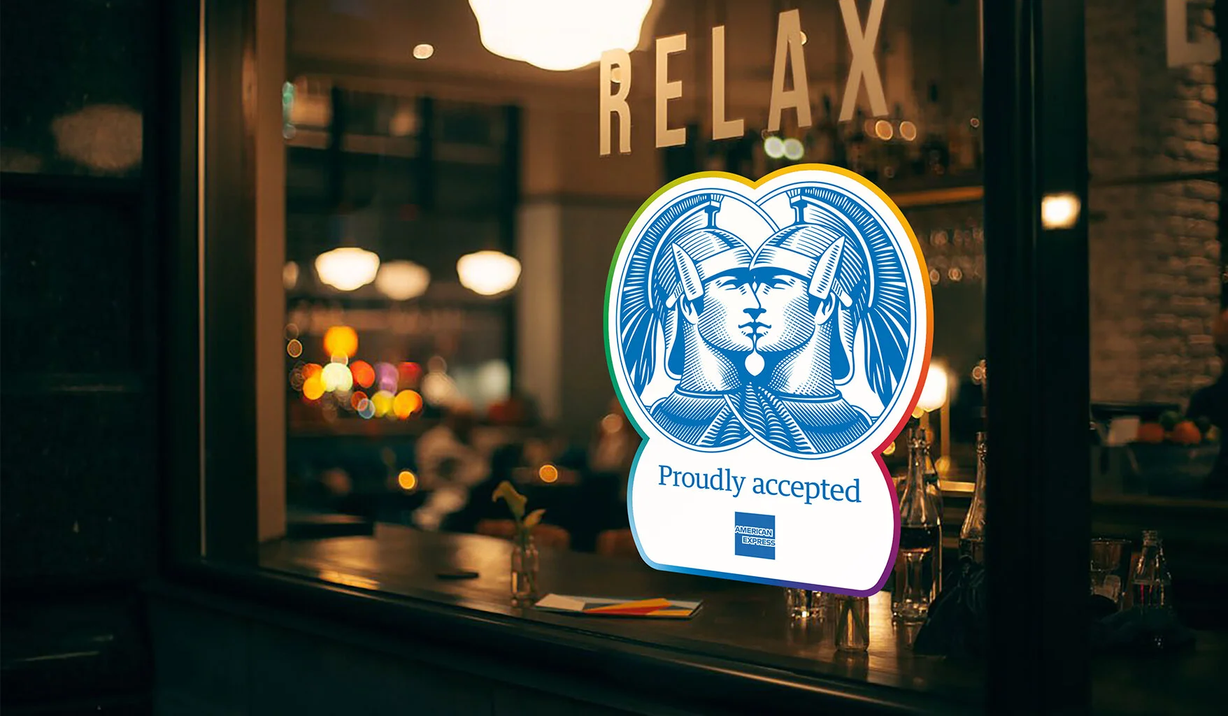  Window decals will be given to merchants that openly welcome members of the LGBTQ+ community, while street posters bring our striking visual to life. 