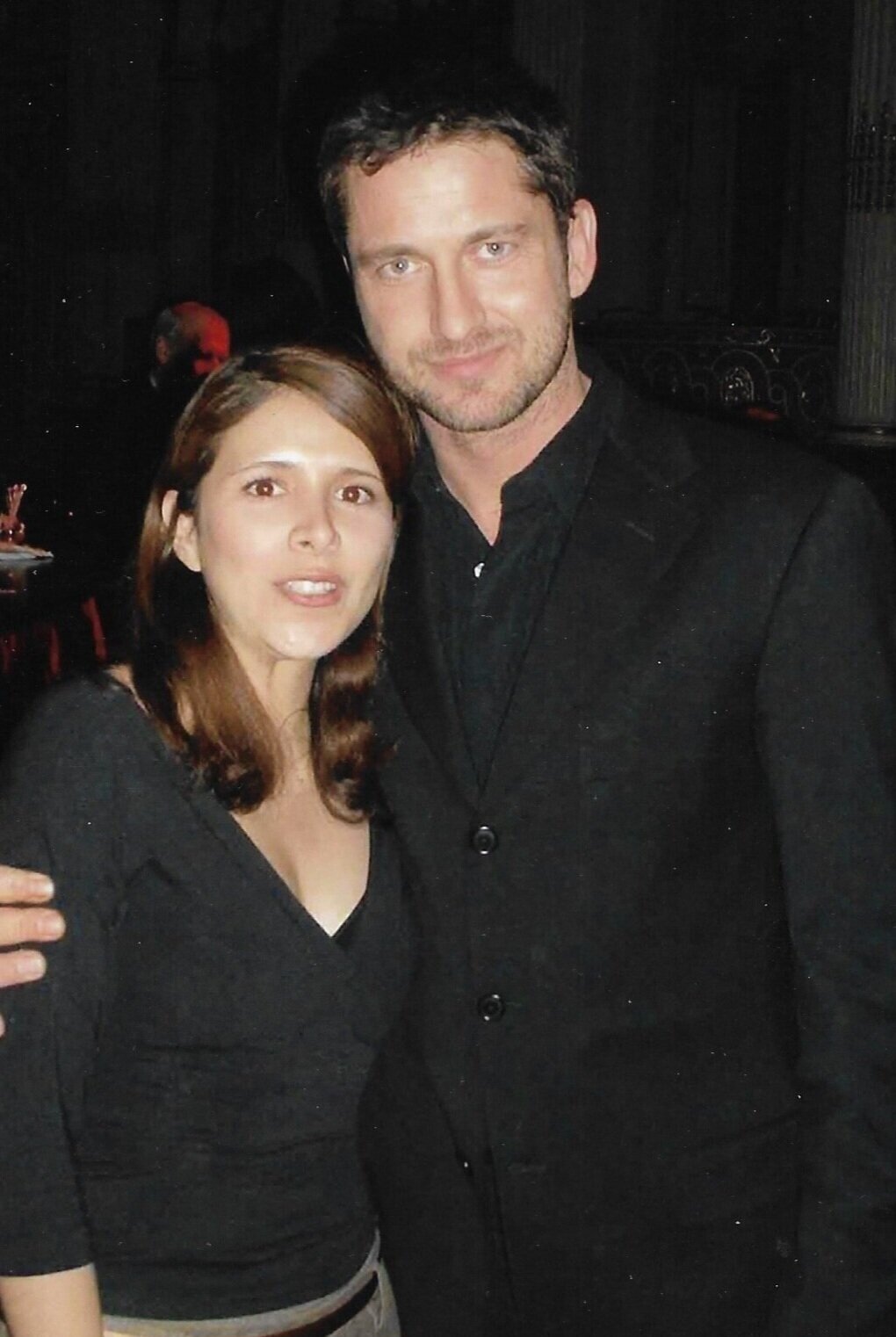 Ana Cuadra with actor Gerard Butler at an event