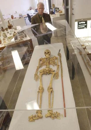 Archaeologist Dr. William Kelso (who in 1994 is credited with rediscovering the site of the James Fort and in the years following, several burial sites, skeletons and artifacts),&nbsp;is seen standing next to remains he believes to be those of Capta…