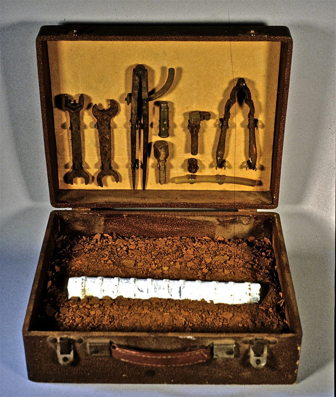Dhghmunculus 30 1996 Leather case, rust, steel, acrylic & tools 15” h x 15” w x 15” d This was a component of my installation "Dhghmunculus" The Lab, San Francisco, October-November 1998 Collection of Alan Millar