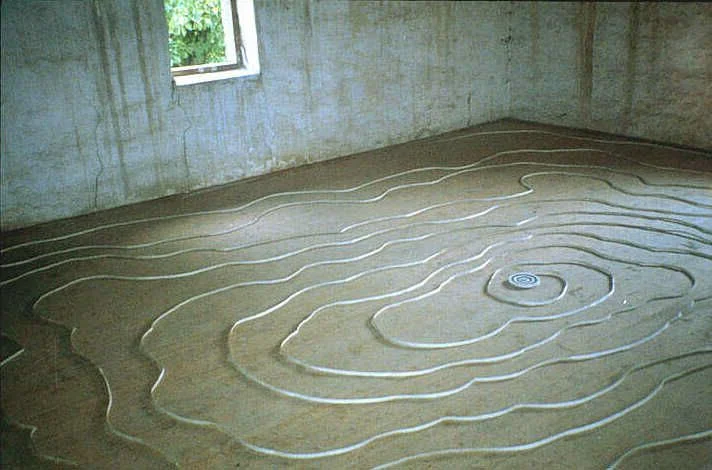 We Have Proven We Can Prove It 1996 unwound paper dartboard dimensions variable; here approx. 18' x 18' exhibited at "Mapping Space: 2nd International Symposium Hrad Klenova” Klenova, Czech Republic 1996
