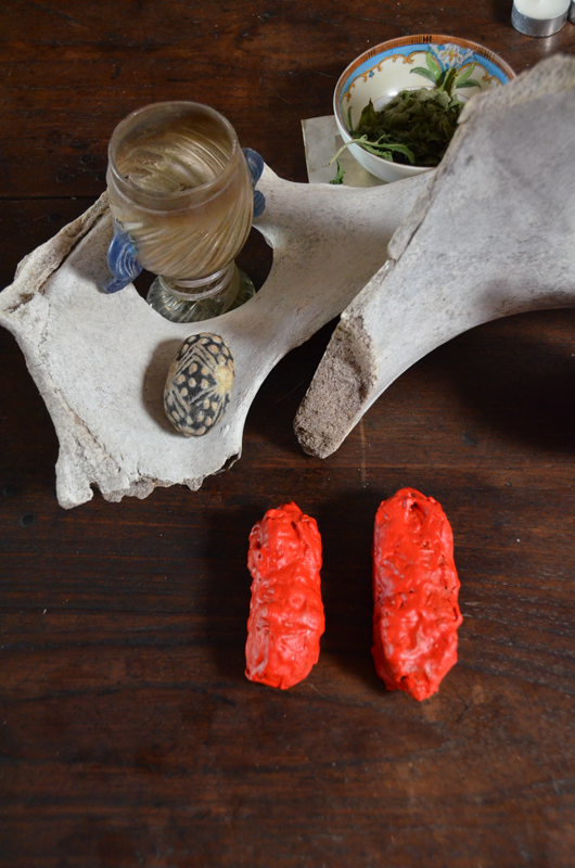 Two dorjes in red wax