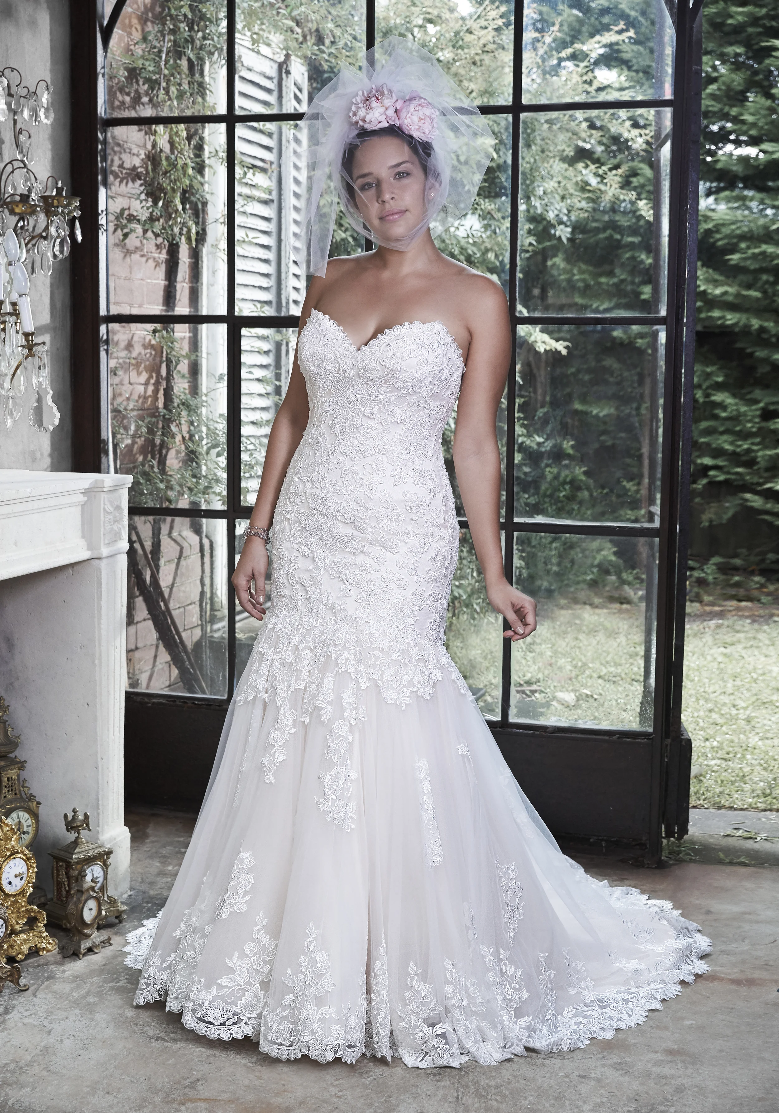 Marianne - Beautifully embellished lace adorns this dramatic fit and flare, with a sweetheart neckline and subtle sparkle. Finished with signature corset back closure. Colors available - White, Ivory, Ivory over Pale Blush