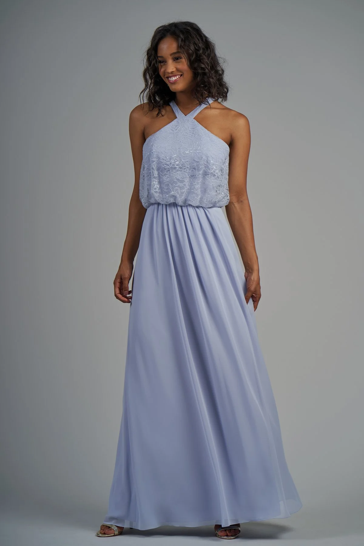 B213014 - Pretty lace and poly chiffon floor length bridesmaid dress with a high neckline and flowy lace bodice. Detailed gathers on the flowy skirt to complete the look. Available in 22 colors