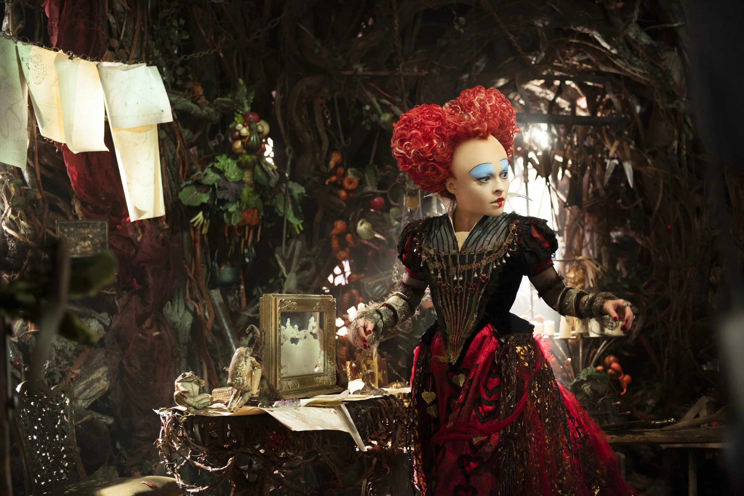This story digs a bit deeper into the past of the The Red Queen (Bonham Carter) too.