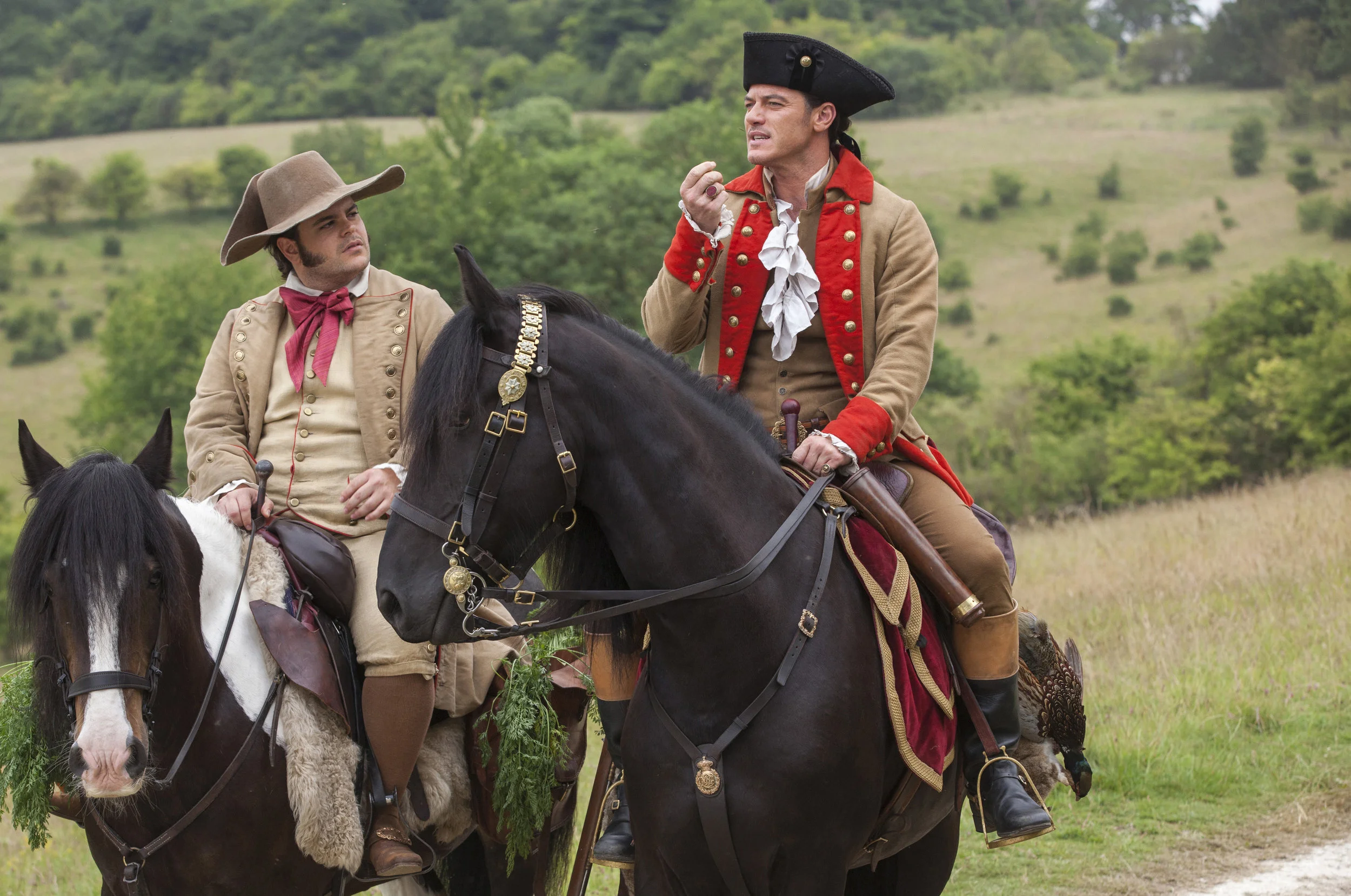 Gaston (Evans) discusses his plan to marry Belle with Lefou (Gad). They fit their roles perfectly!