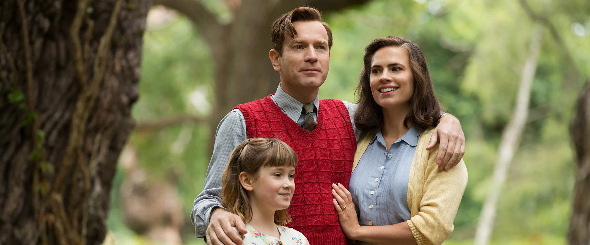 Christopher Robin (McGregor) is living the grown up life with wife Evelyn (Atwell) and daughter Madeline (Carmichael).