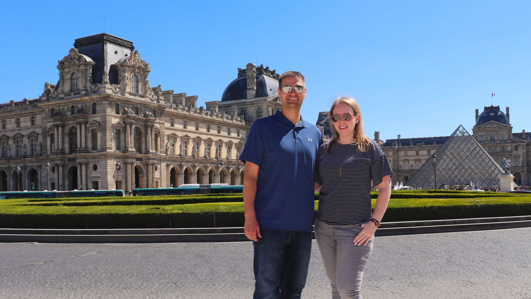In front of the iconic Louvre Museum.