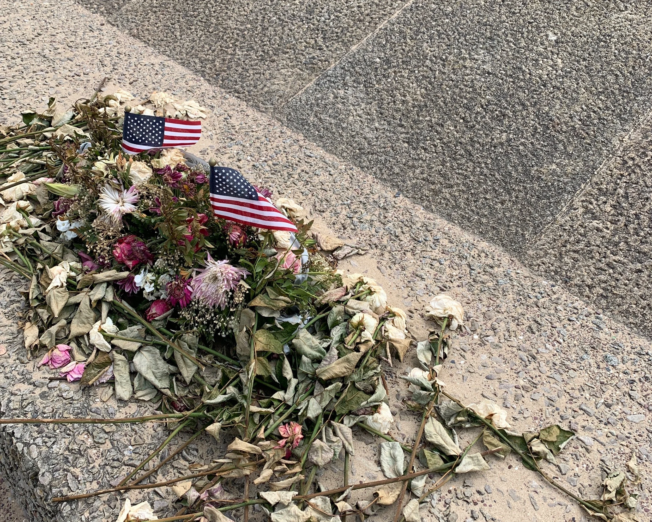 Flowers left at the memorial.