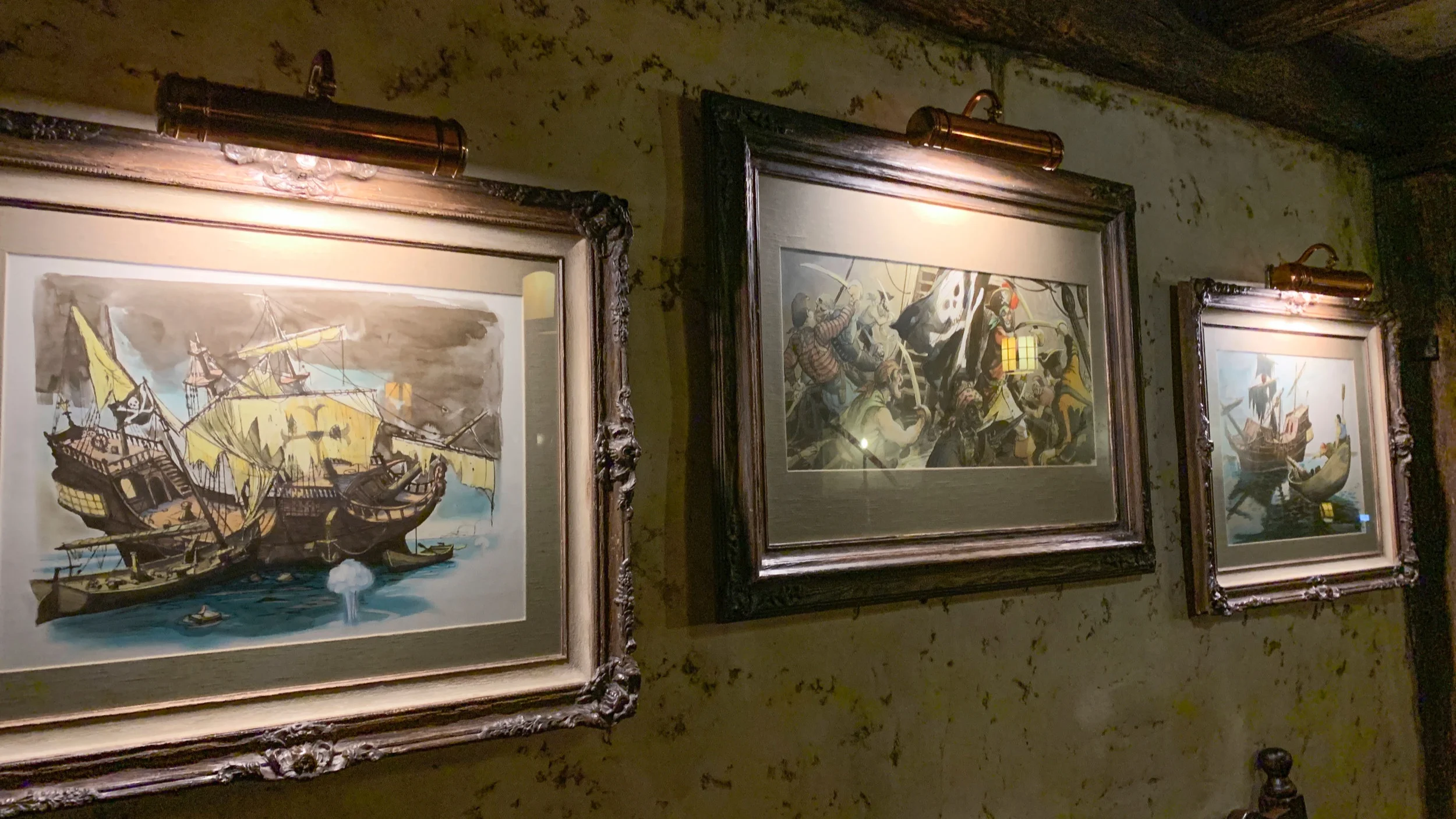 Vintage ride artwork in ornate frames.