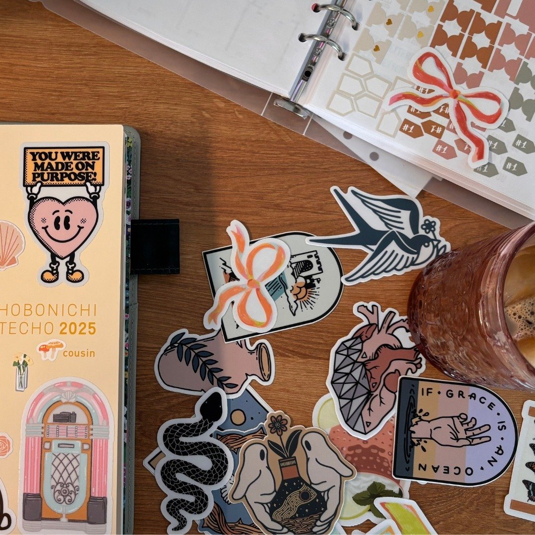 Using a paper planner helps me log off from the digital world and empty my mind onto physical pages. It's my creative outlet where I can organize thoughts, doodle ideas, and plan without distractions. I might also be a sticker hoarder and pen fanatic