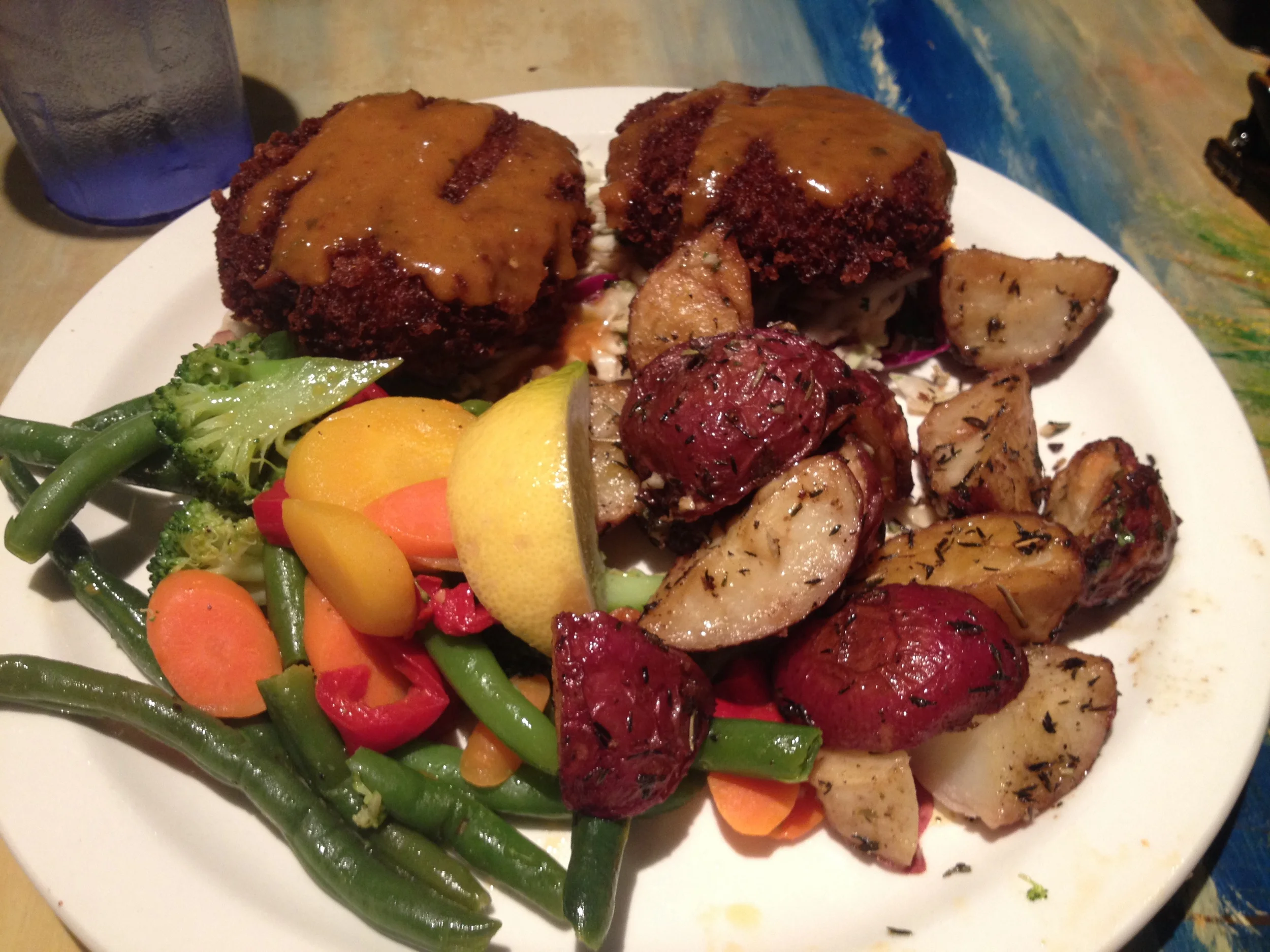 Crab cakes with asian slaw and roasted garlic potatoes