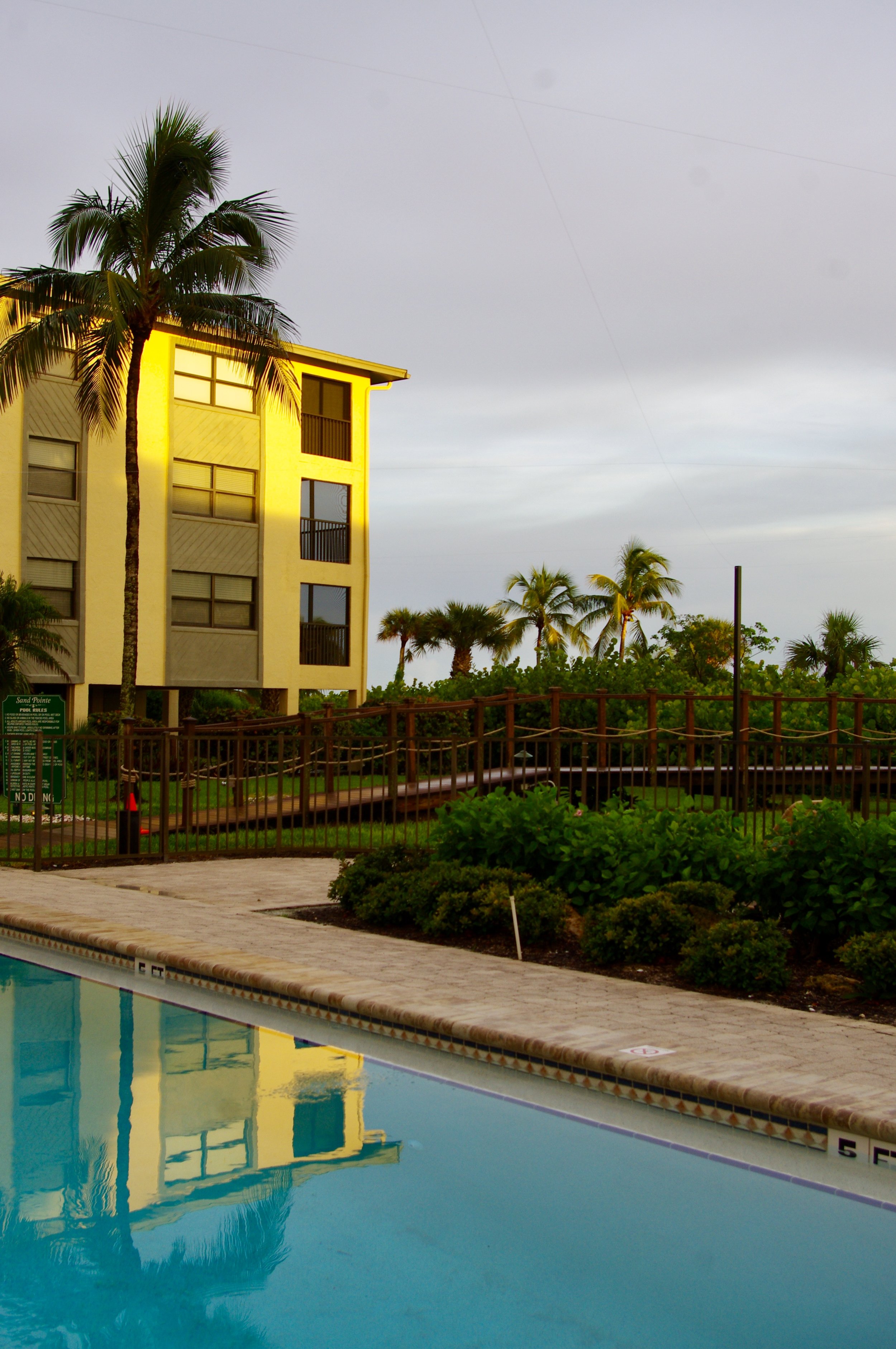  The sun begins to set over the pool and boardwalk 