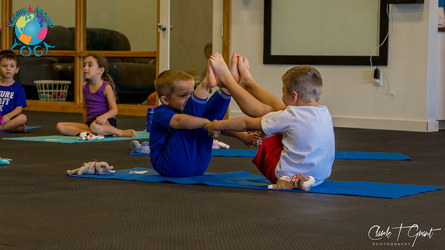 Kids doing yoga poses together. (C)Kidding Around Yoga