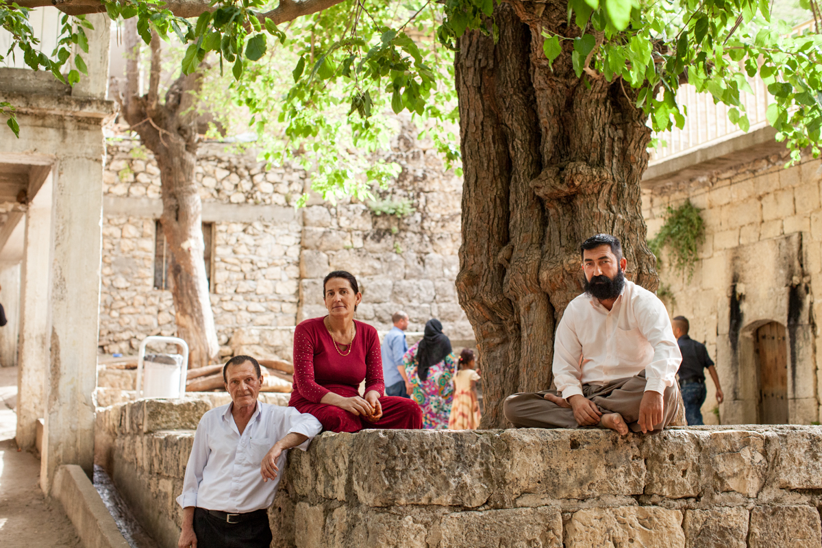  Three Yazidis ceremonially barefoot at Lalish, the valley temple in northern Iraq. It is the holiest temple of the Yazidis people (2016). 