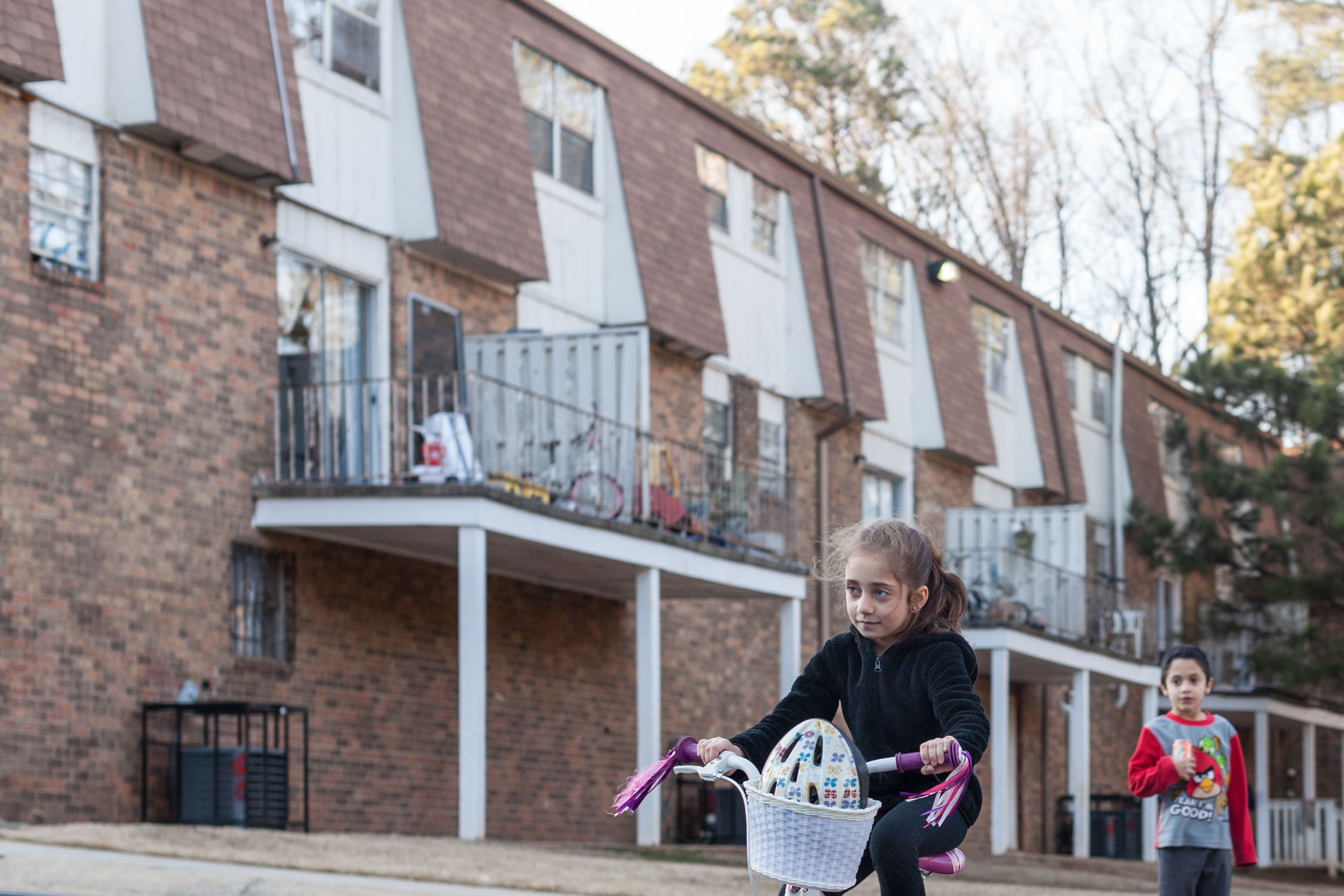  Joanna, a Syrian refugee at their apartment complex in Clarkson, Georgia.  Full story  HERE . 