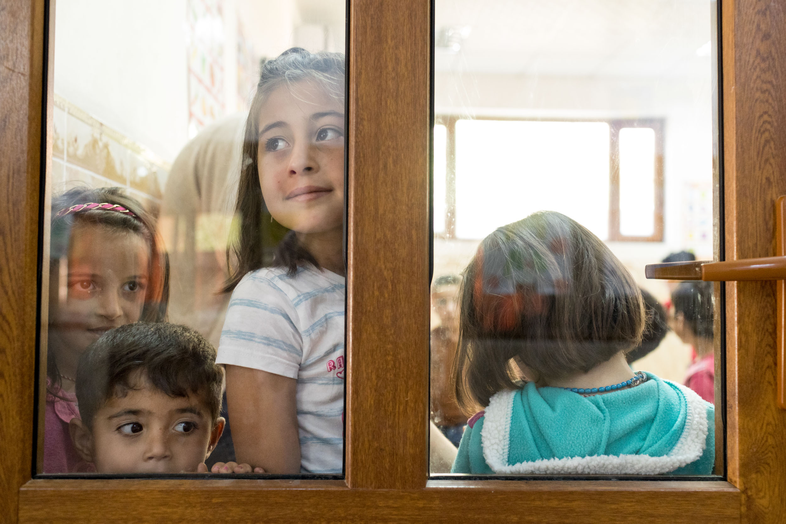  Children from southern Iraq, Sinar, and Syria at the local school built for  children displaced within the region (2016). 