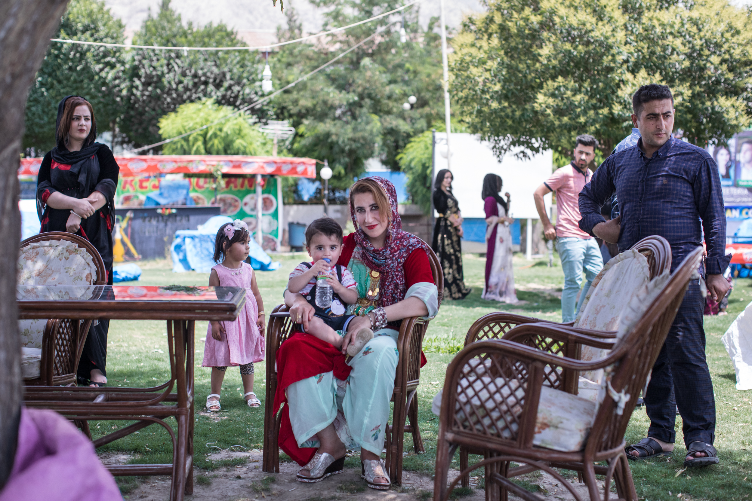  Kudish woman with her son at a family wedding celebration at Gulan Park in Iraqi Kurdistan (2017). 