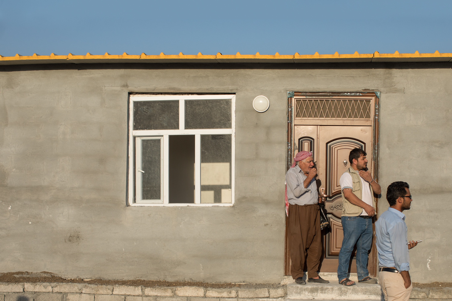  Three Syrian Kurdish men inspect their new home in Azadi, Iraqi Kurdistan (September 2017). 