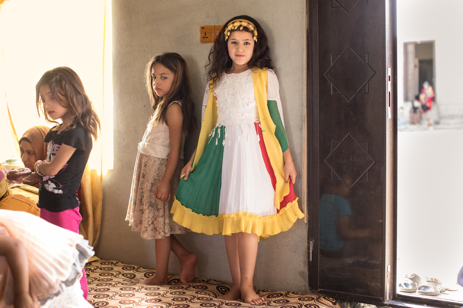  Kurdish girl proud of her Kurdish dress minutes after the power went out and  playing in makeup with the other girls (2017). 