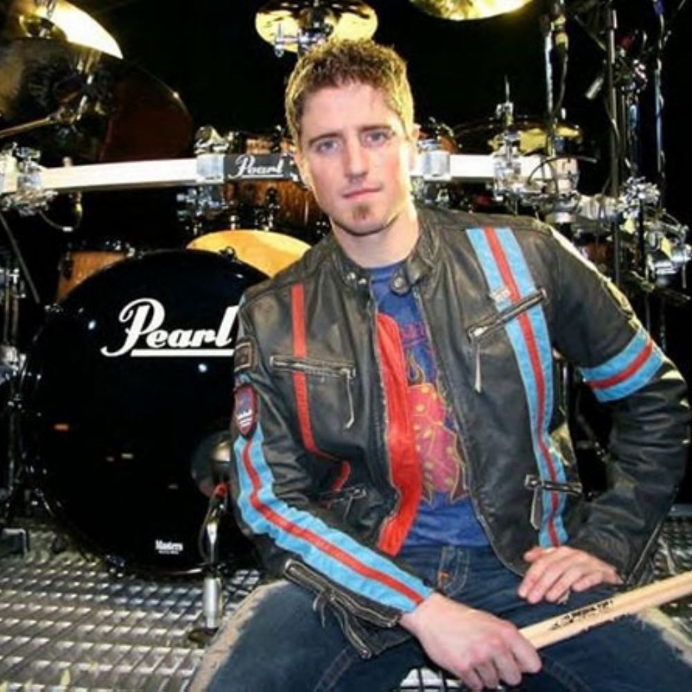 DANIEL ADAIR: (drummer) Nickelback