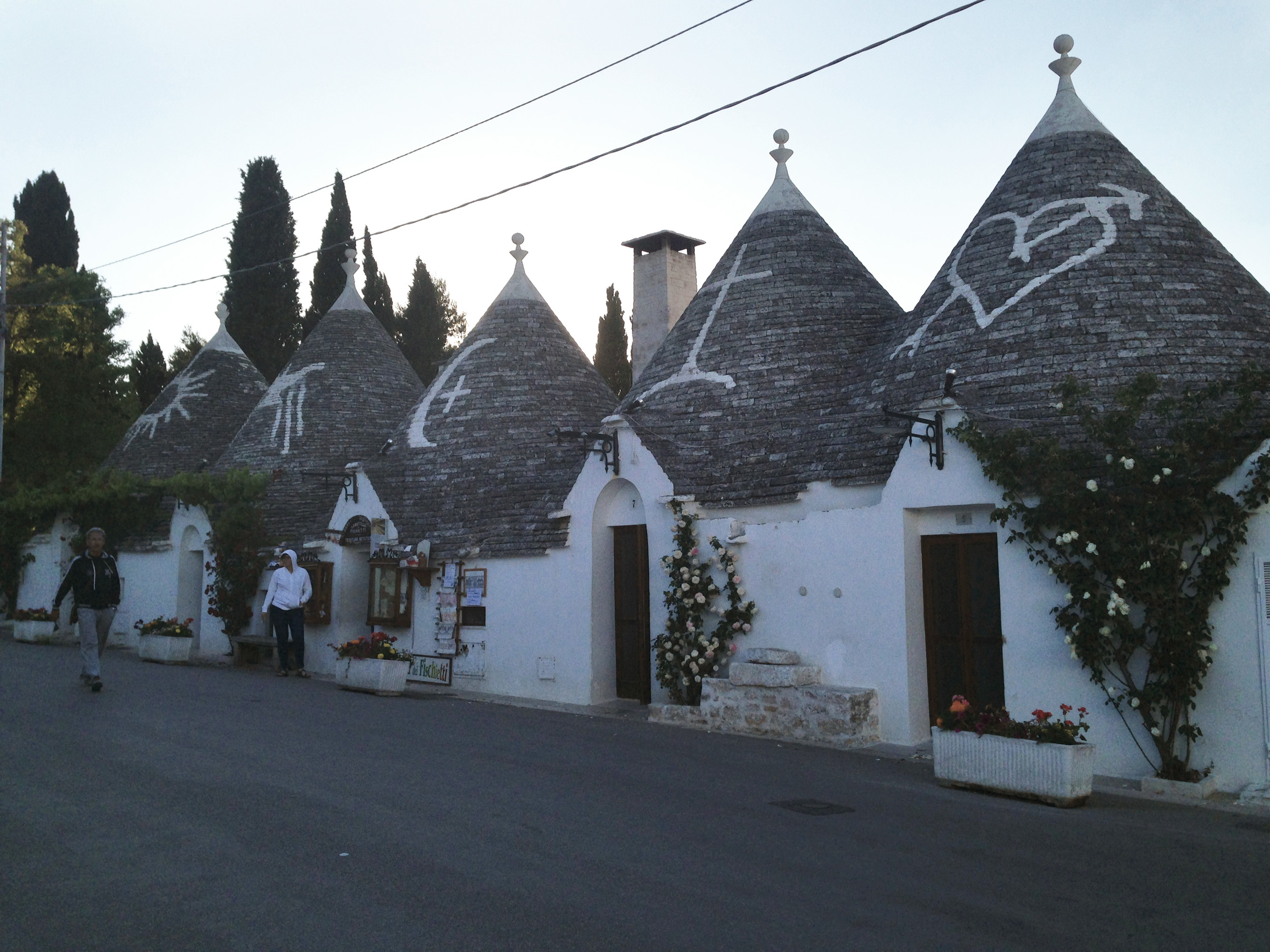  Some of the trullis have symbols painted in white on the rooftops that have spiritual and/or magical meanings.&nbsp; 