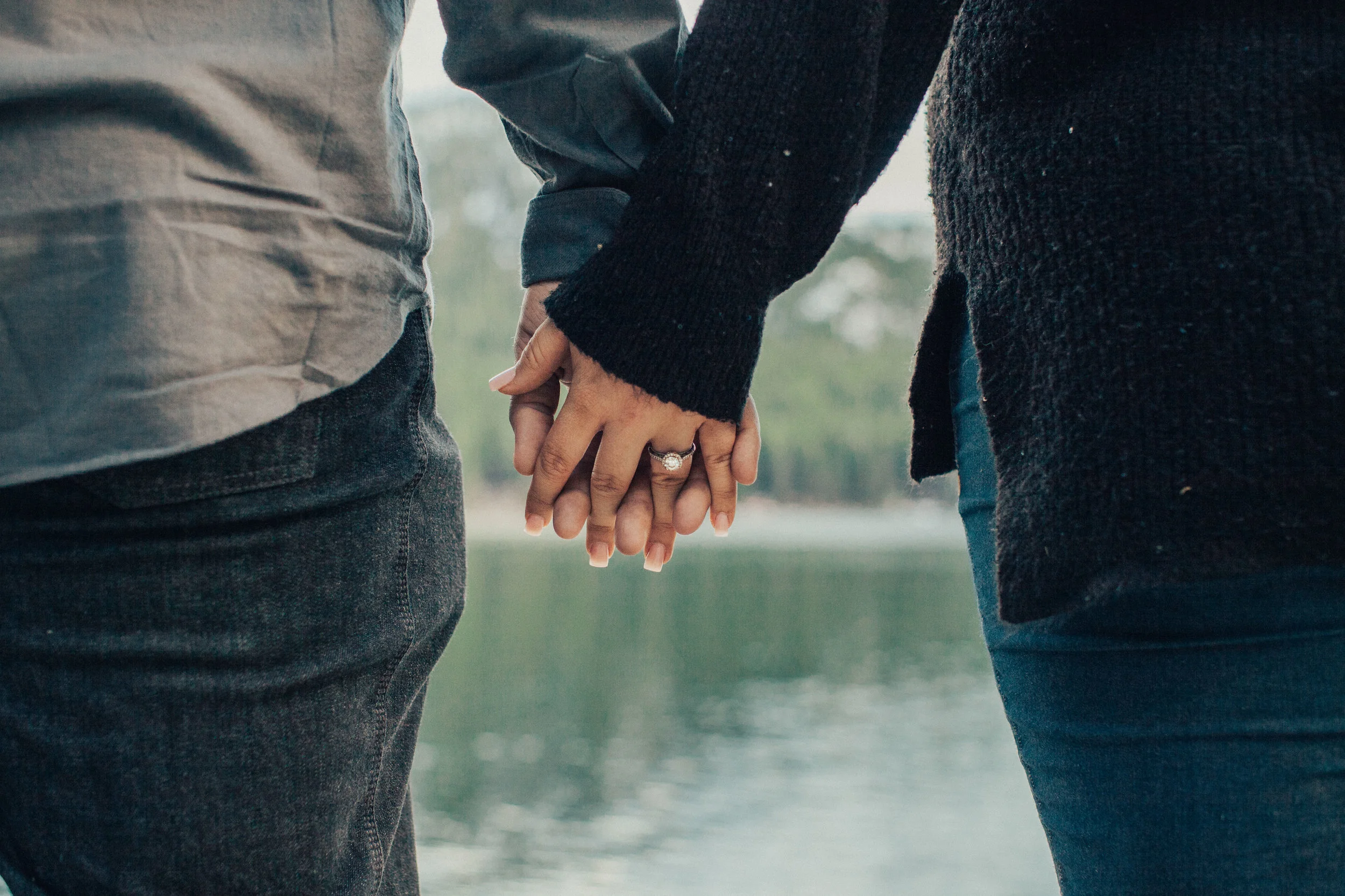Ring shot in front of the lake during an engagement session.
