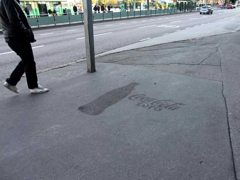 Coca-Cola-using-everse-graffiti-cleaned-advertising-Finland.jpg
