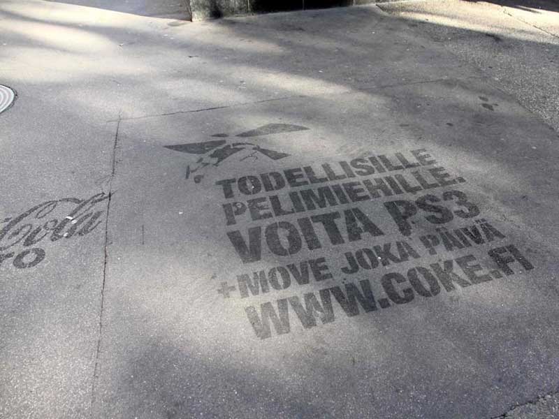 reverse-graffiti-cleaned-advertising-Coca-Cola-on-sidewalk.jpg