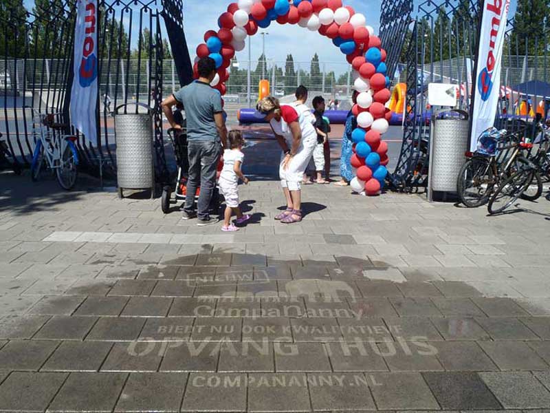 reverse-graffiti-cleaned-advertising-in-front-of-an-event.jpg