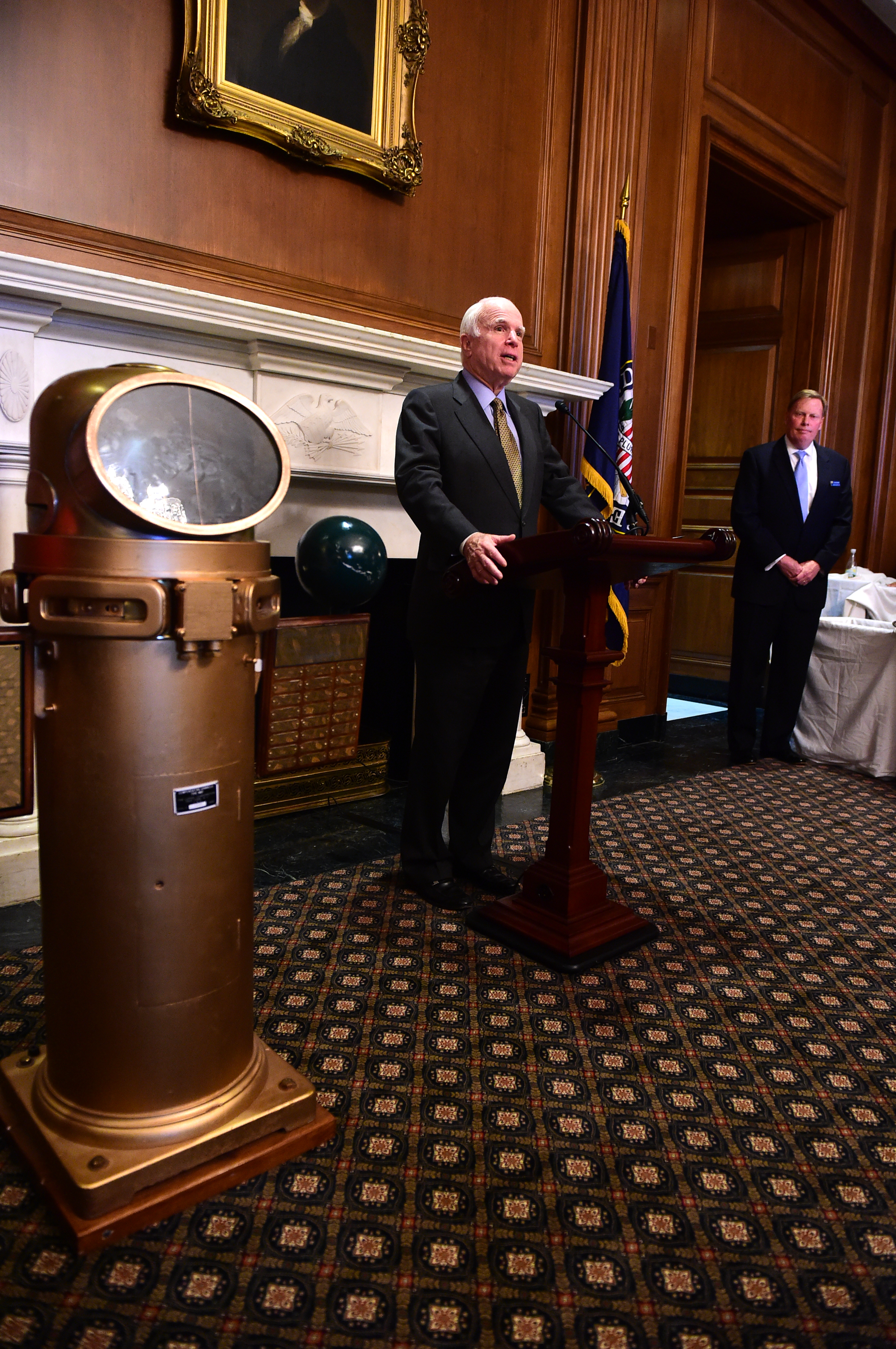 Senator McCain receiving the 2014 Sea Service Award with Doug Denneny, VP of the National Capital Council of the Navy League in the background