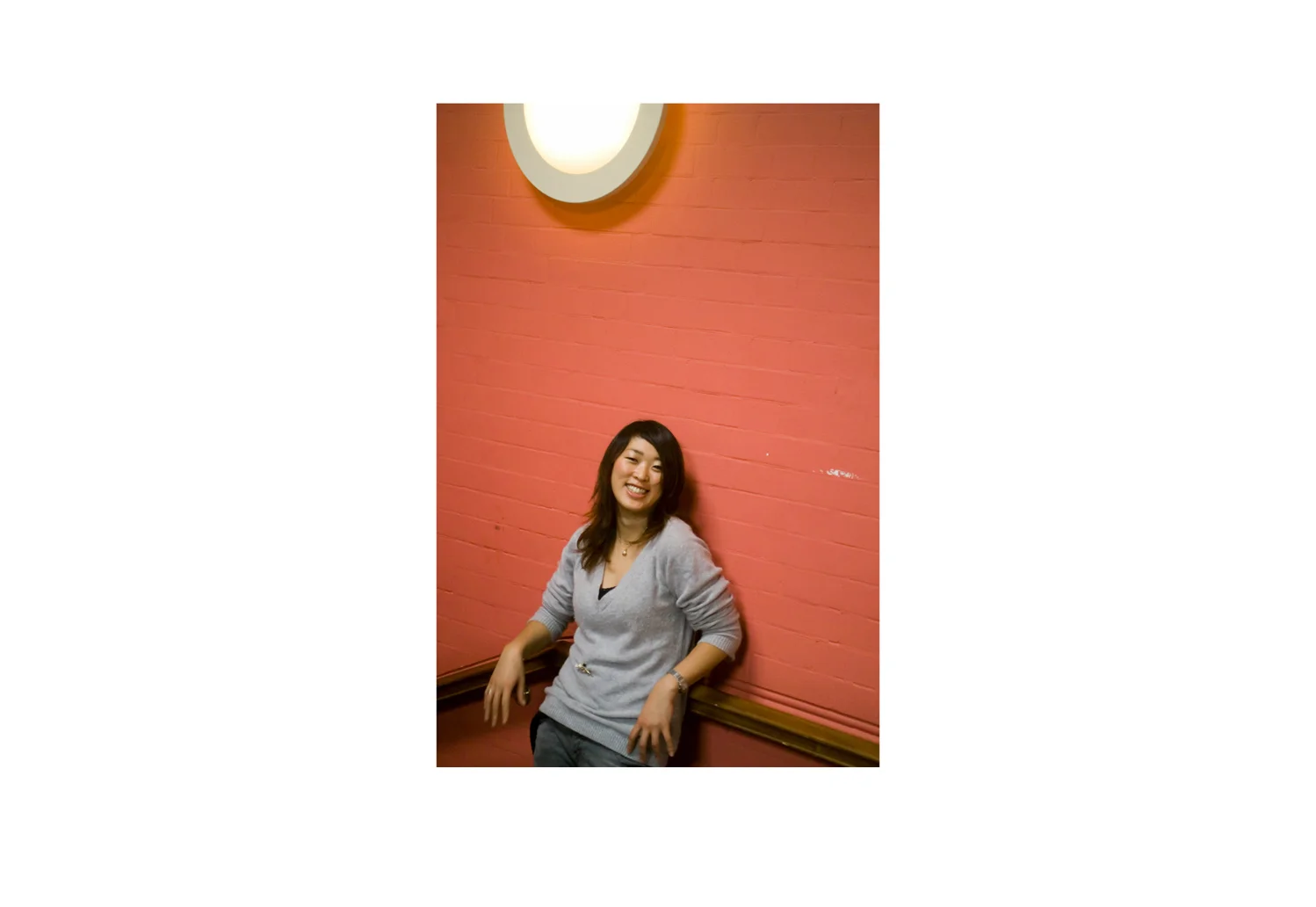 Woman, Lights and Salmon Pink Wall
