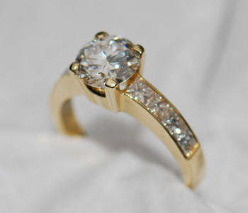 solitaire-diamond-ring-with-diamond-shoulders-yellow-gold.jpg