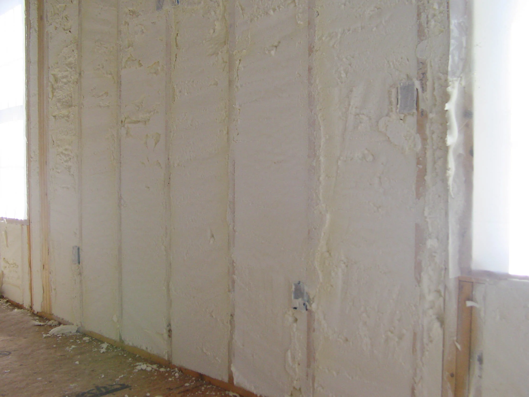 Foam-in-place : Foam is blown in place and creates an airtight seal. This is primarily for doors and windows and can be used between studs on exterior walls instead of traditional fiberglass rolls.