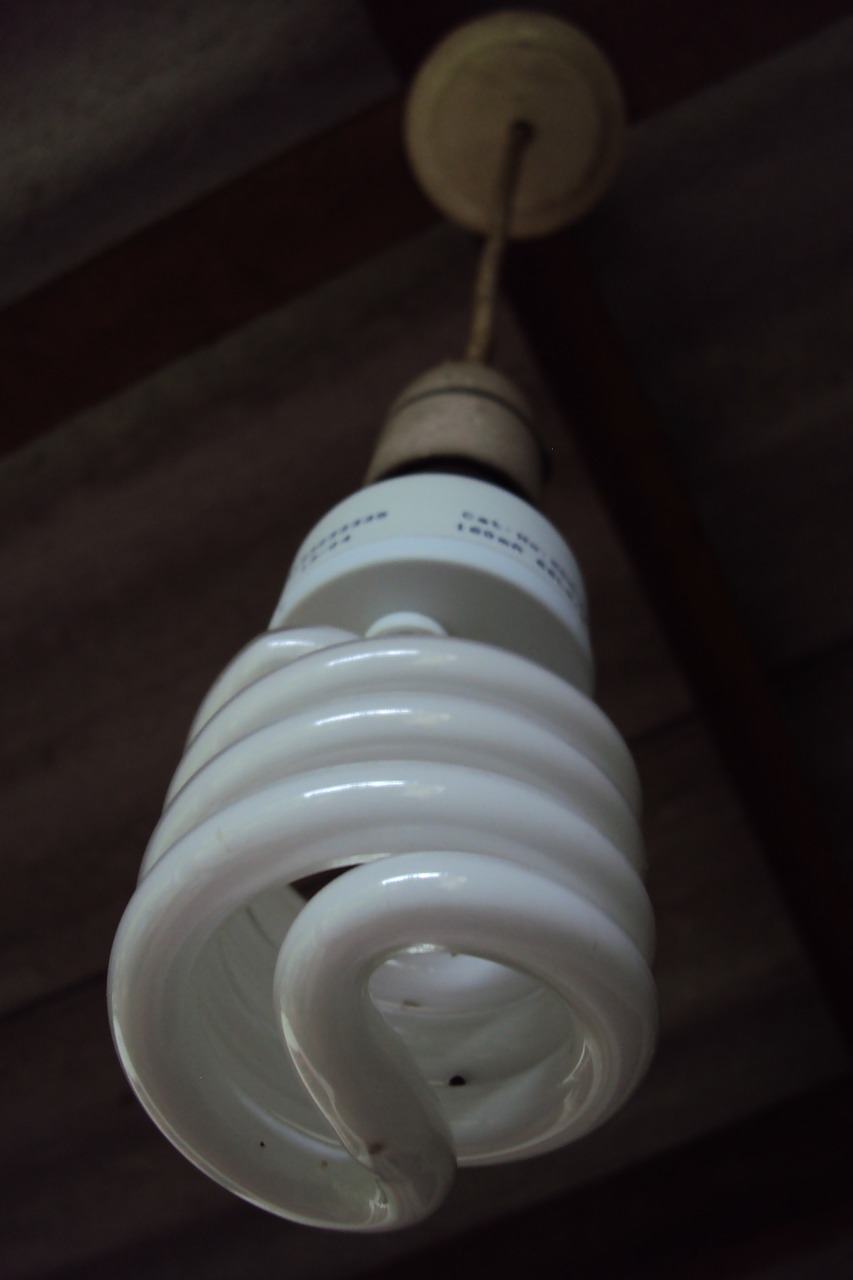 A compact fluorescent bulb was invented when General Electric discovered a way to take a traditional fluorescent bulb and manipulate it into a compact, spiral shape. 