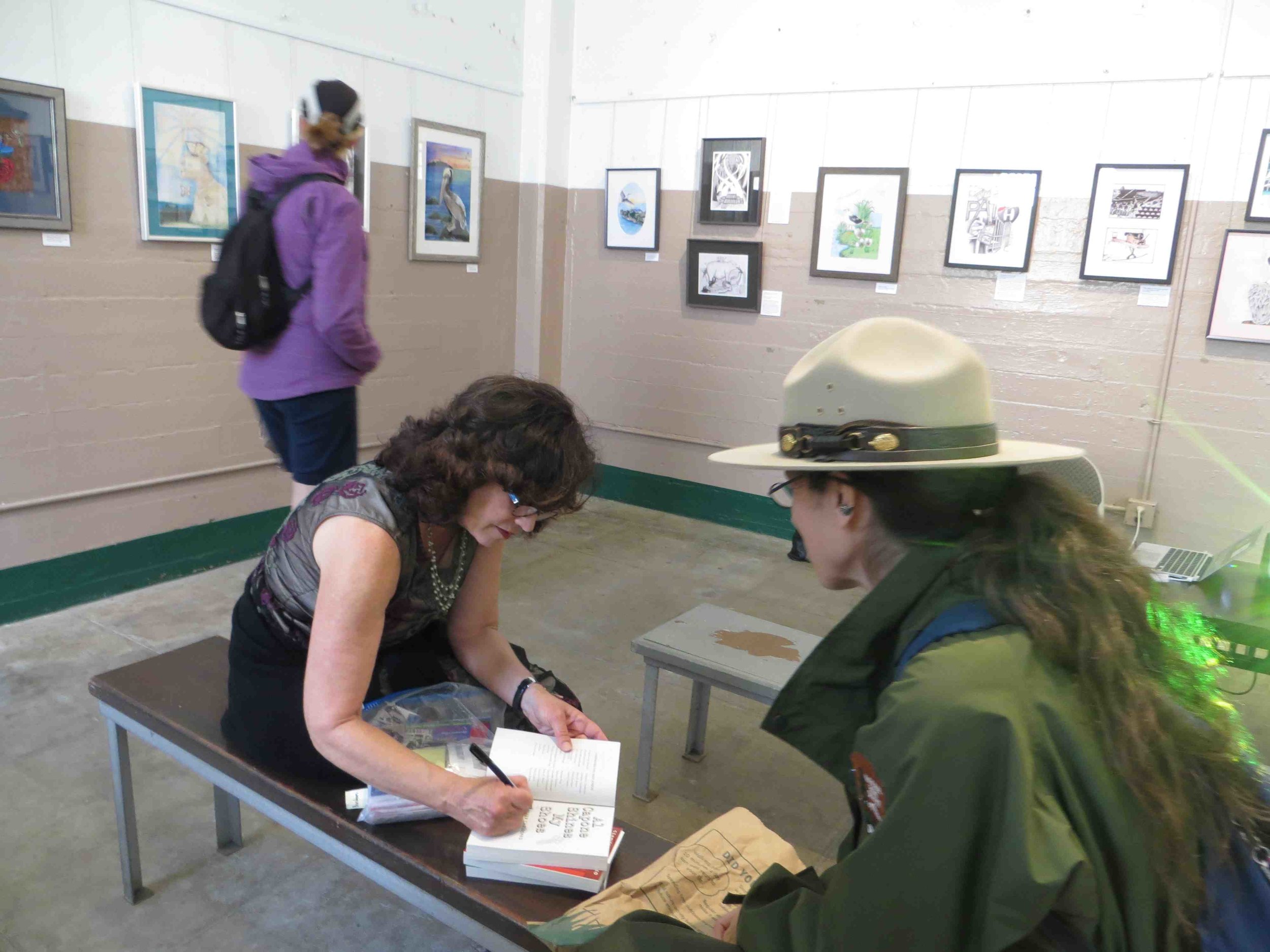 Gennifer Choldenko signing books for Ranger Kathryn.jpg