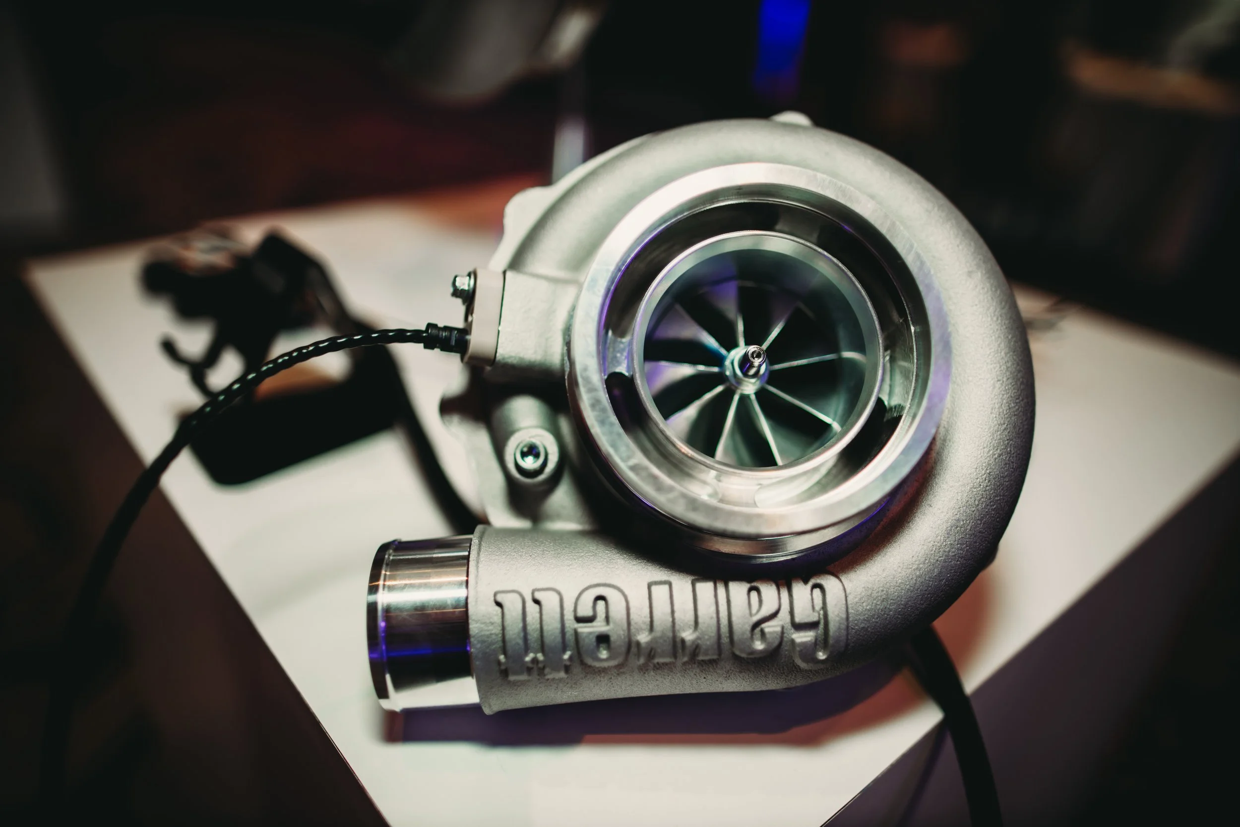 Garrett Motion turbocharger display at a corporate event. Natural light, 24mm