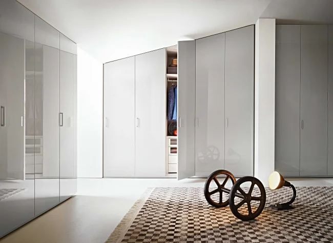 HINGED DOORS BY LEMA Made to measure wardrobe is the modular system that offers maximum freedom of construction due to the wide range of modules available and the ability to cut according to the desired size, height, width, depth. It is available with hinged door - in 5 heights, 6 widths modules that can be combined with each other, with opportunities to choose between 18 types of doors and folding doors - or with sliding door - in 3 heights, 5 widths with the possibility of choosing from 8 different types of doors.