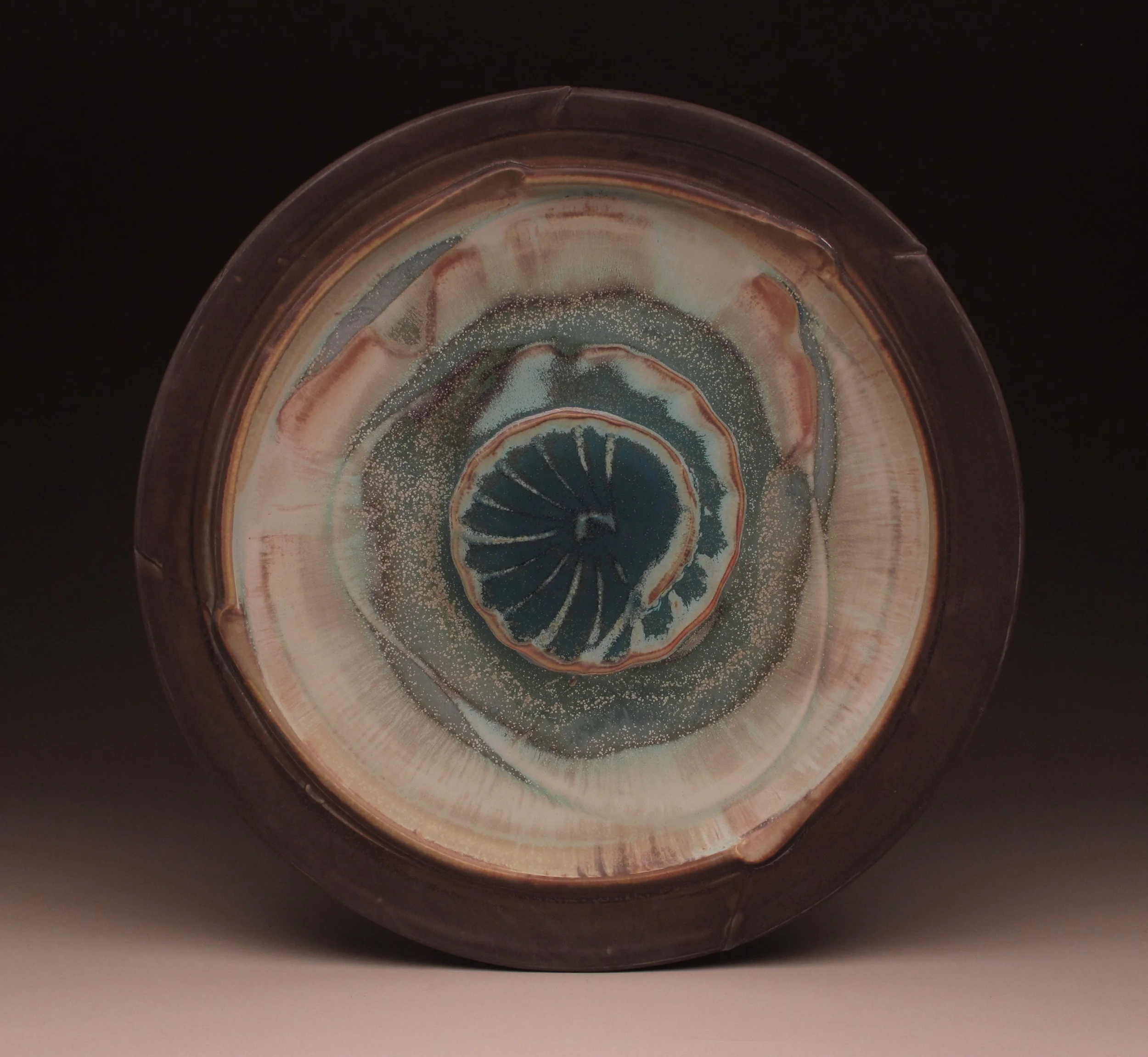 Platter , ribbed slip design, multiple sprayed glazes, ^8 electric fired, 19" diameter, 2014