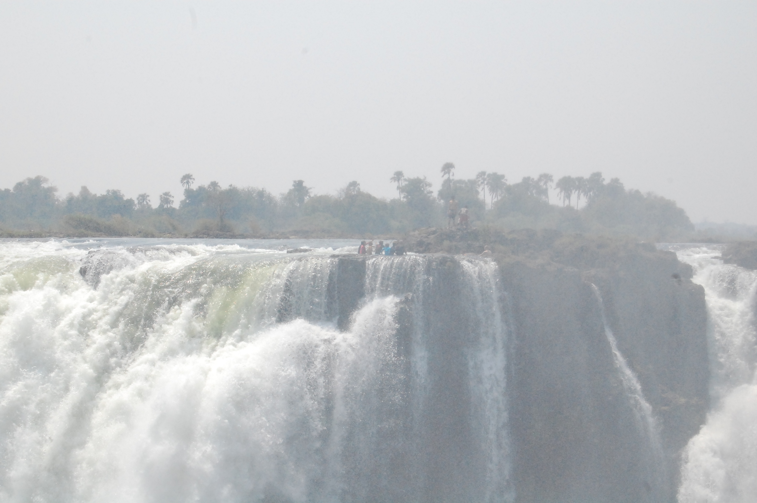  During the dry season ONLY, you can enter Devils Pool, which is on the Zambia side of Victoria Falls. &nbsp;Those people in the distance are literally sitting on the waterfall.  I knew this was something I wanted to do, but I did not realize it was 