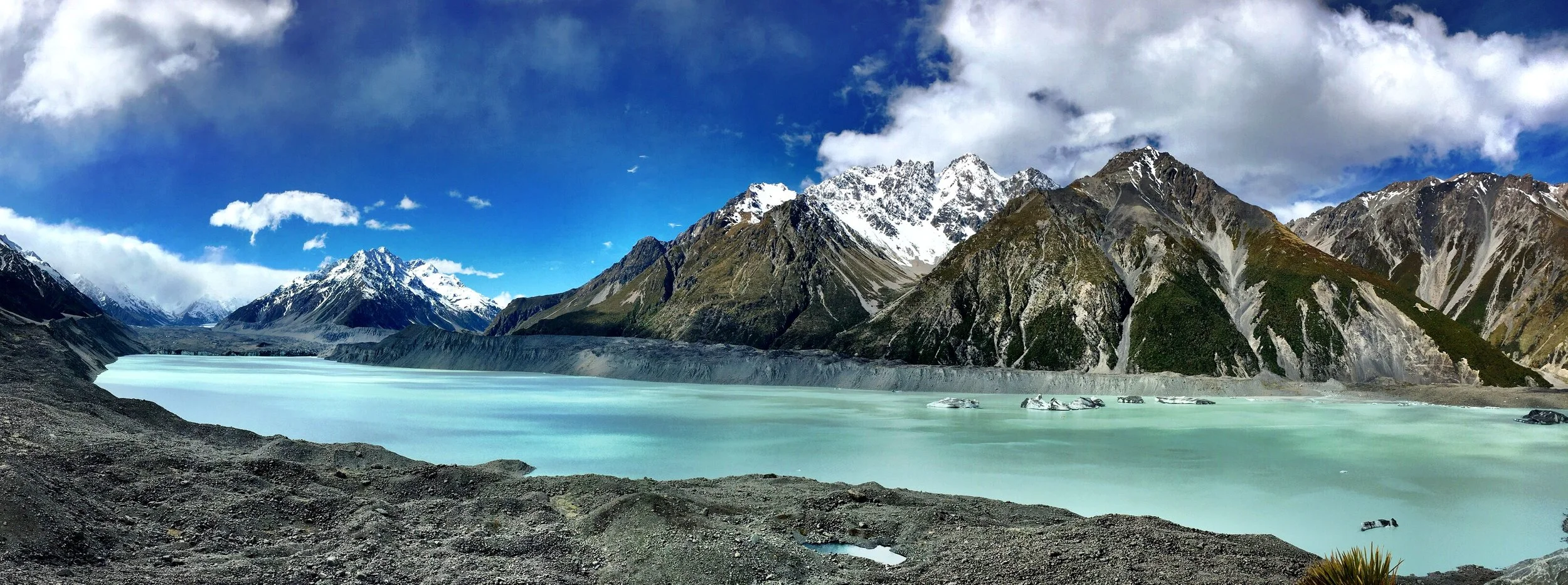  Further toward Mount Cook is the  Tasman Glacier  lake which runs into Lake Pukaki. &nbsp;I probably wouldn't be so obsessed with the SI if it wasn't for this place. &nbsp;I mean, LOOK AT IT. &nbsp;Have you ever seen something with water that clear?