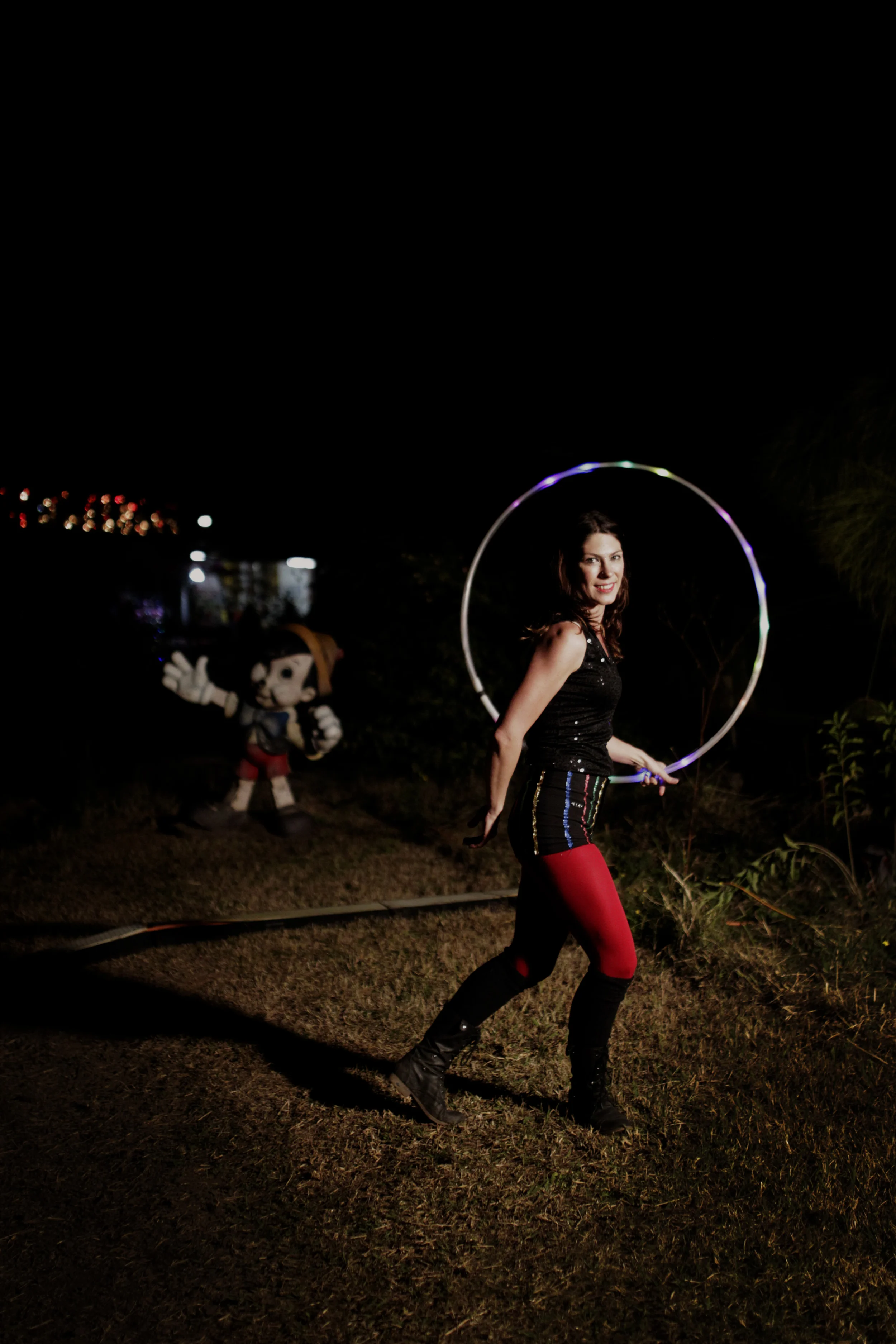 Hoola hooping with an abandoned Pinocchio looking on in amazement.