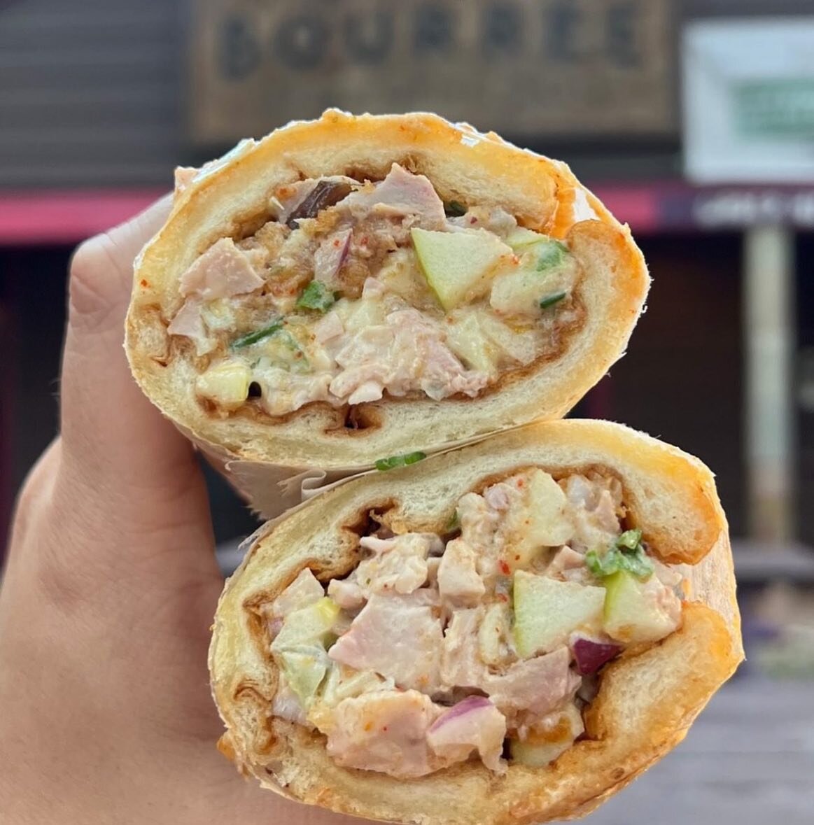 ✨NEW✨ On the menu: Our chopped smoked chicken salad sandwich is rolled up in a @dpbakerynola pistollete 🤤

Chicken salad is fried chicken, green apples, red onions, green onions, and so much more. Come try it for yourself! 🙌

📸: @aintthatphancy