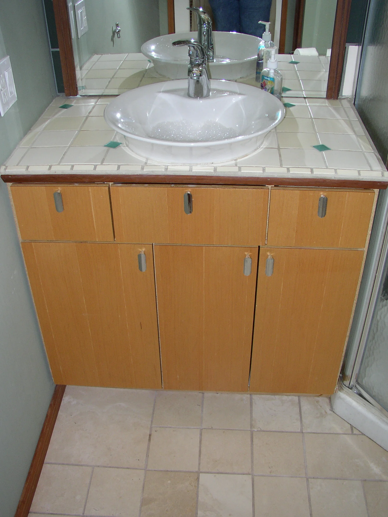 Wimsical tilework and CVG doors with reclaimed pulls