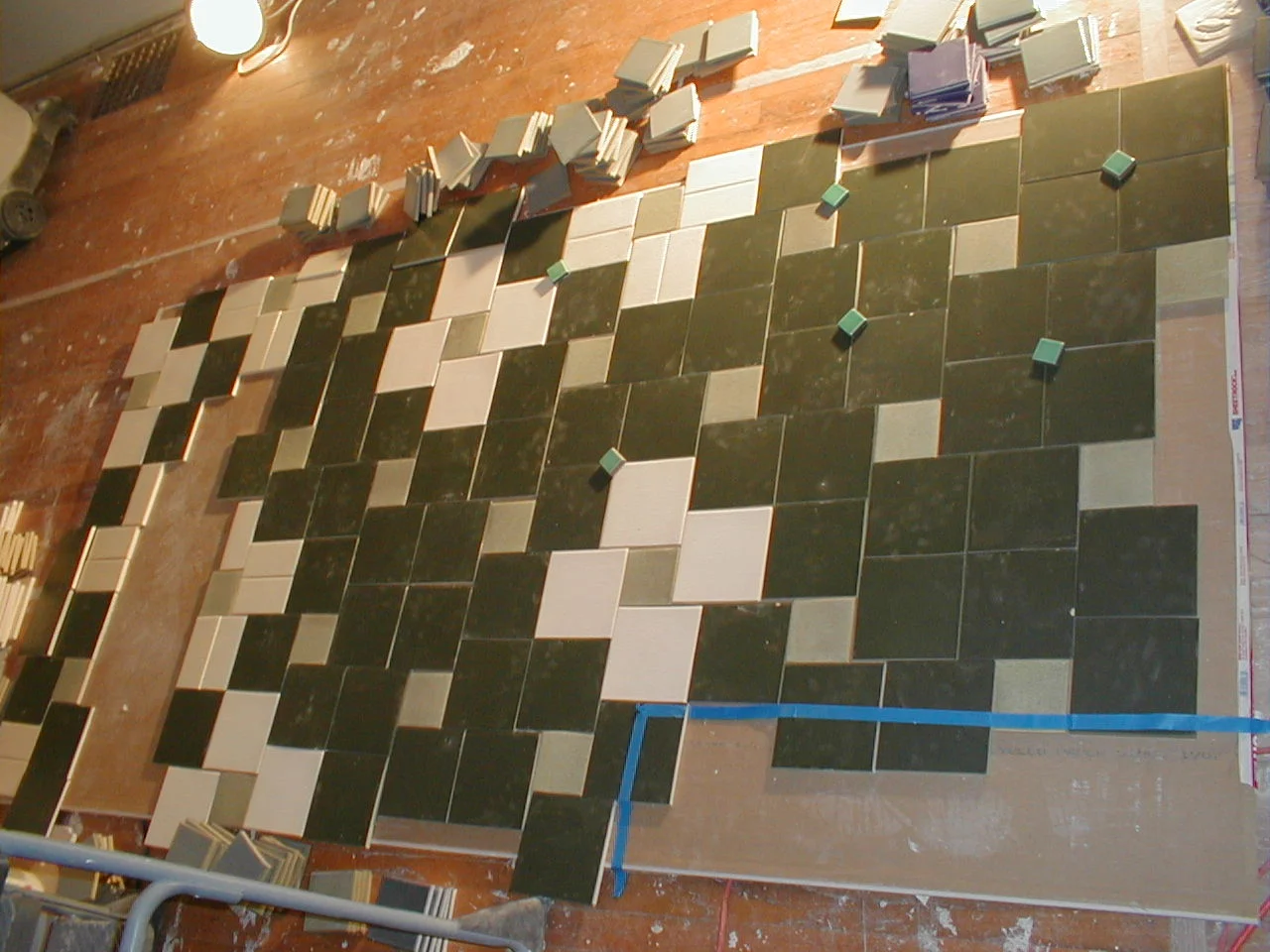 Since there was only so many of any one color tile (warehouse sale) the design needed to be laid out exactly before being installed