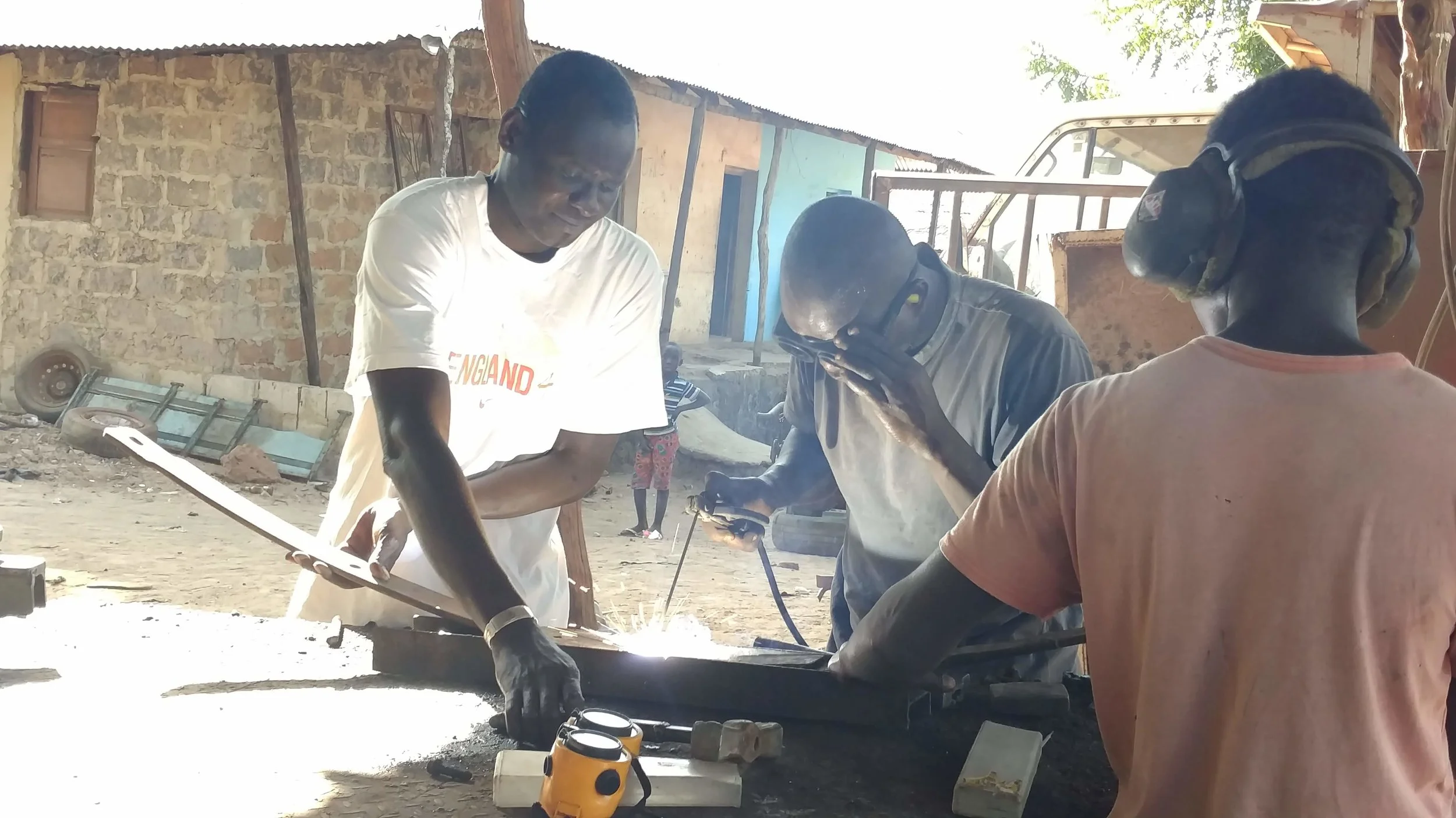 Sergio, center, welds together a piece of metal at a the local welding shop where he works. A few years ago, Sergio was unemployed and only made a few dollars here and there from working odd jobs. Determined to escape a life of poverty, he enrolled in the WAVS Vocational School’s welding program.