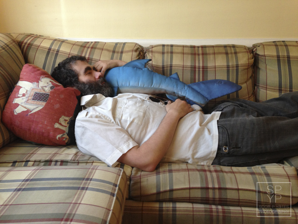 Todd takes a nap with a stuffed toy shark at his home in Richmond in June 2015. Photograph by Scott P. Yates.
