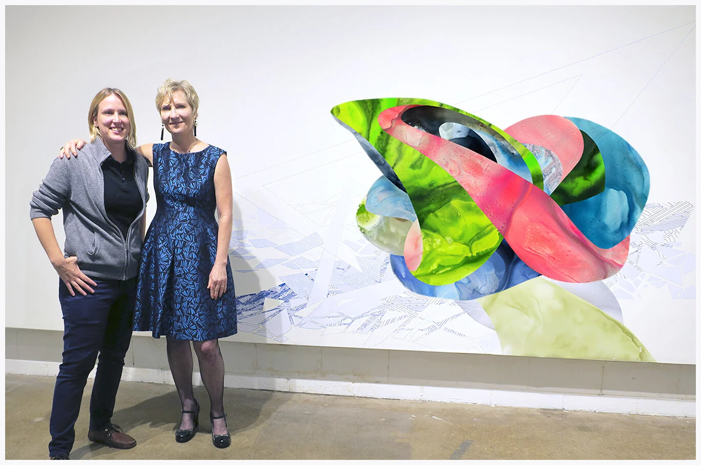 Melissa Breitenfeldt and me at the Rosalux Gallery Opening by our vinyl wall piece collaboration .